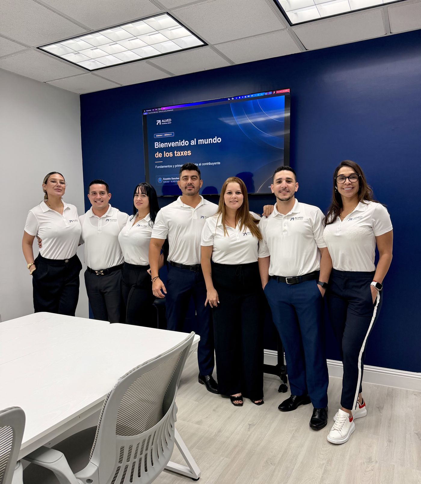 ALVED Financial Group team in company uniform in the training room